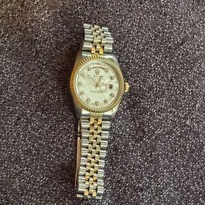 Rolex Silver and Gold Watch with Diamond Accents